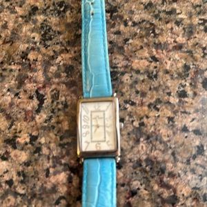 Anne Klein vintage watch with teal strap.